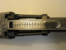 Close-up of engraved gun mechanism