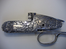 Detailed engraved design on Watson Bros gun mechanism