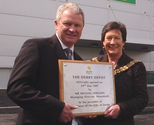 The Mayor of Derby holding a stainless steel presentation plaque manufactured by able engraving